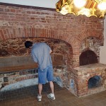 John inspects a colonial kitchen